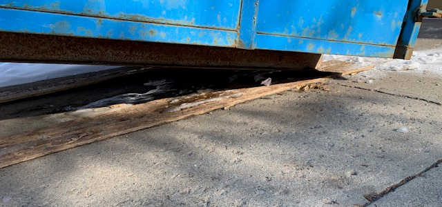 protecting a driveway while placing a bin